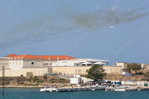 Shells fired from the Grad multiple launch rocket system at the Navy Day celebration fly over the Konstantinovskaya battery in the city of Sevastopol, Crimea