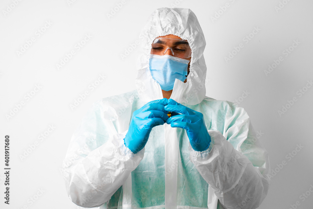 Fototapeta premium Doctor or nurse in protective medical suit preparing for vaccination