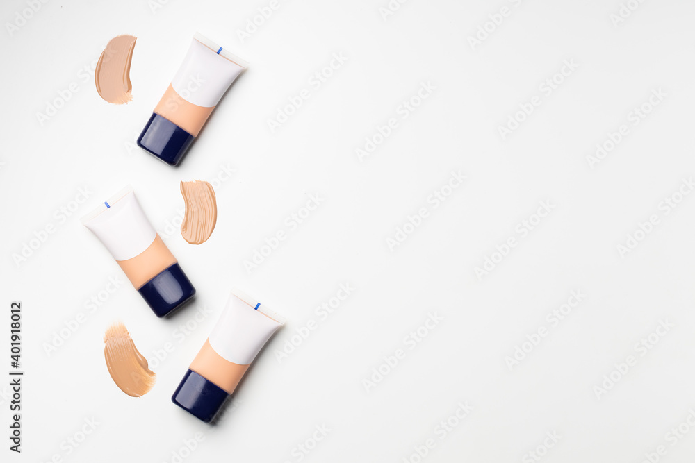 Tube with face liquid foundation on white background Tube with face liquid foundation on white background