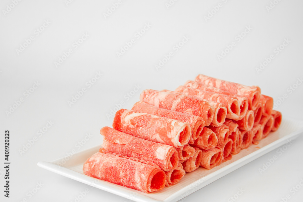Sliced beef close up for Chinese hot pot. Chinese food. Sliced beef close up for Chinese hot pot. Chinese food.