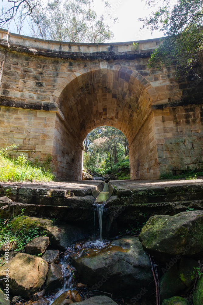 Flowing water under Lennox Bridge, the oldest arch bridge in Australia.