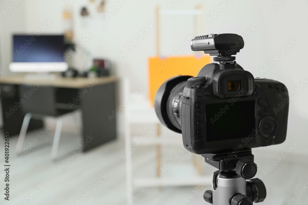 Professional camera on tripod in modern photo studio Professional camera on tripod in modern photo studio