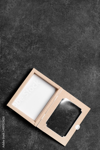 Blank cardboard box on dark...