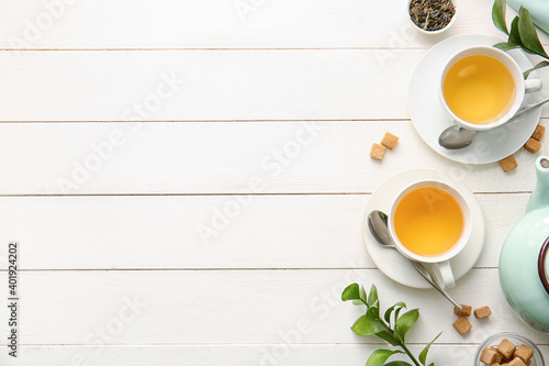 Cups of green tea on table