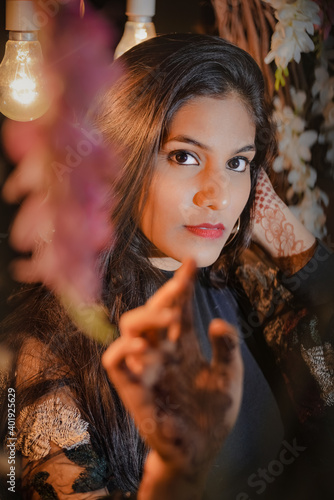 Young blond attractive woman is looking seriously at the camera