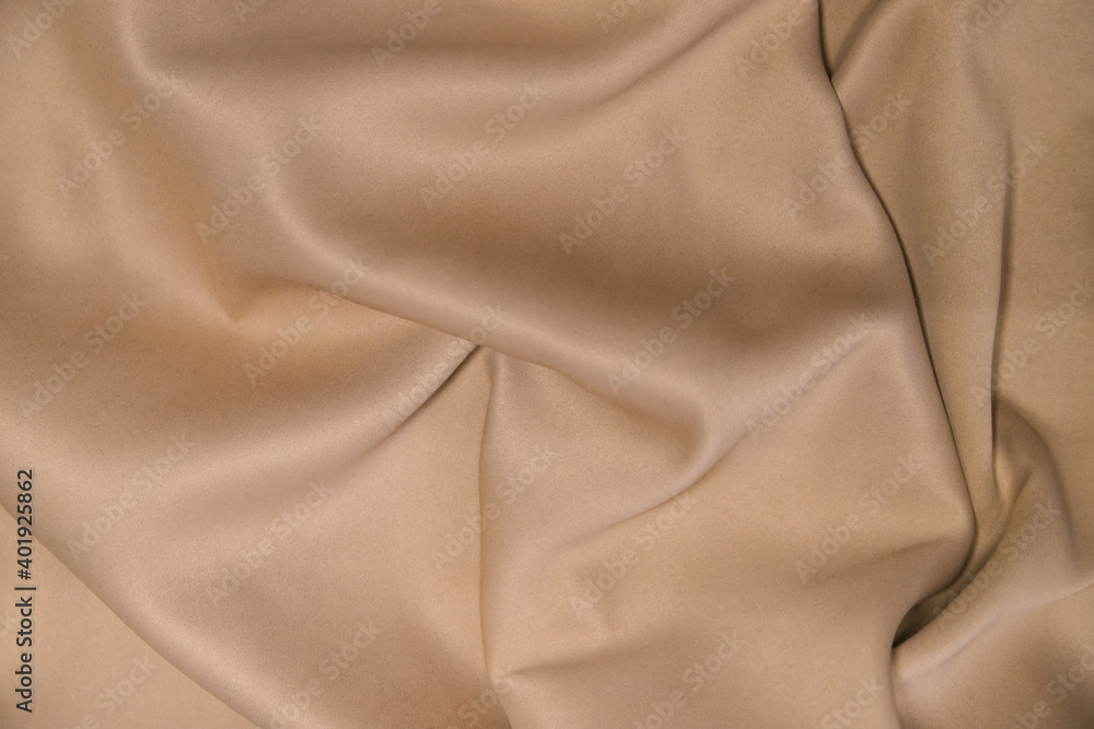Fototapeta premium Abstract background of luxury fabric.Folds in waves of silk fabric. The texture of the satin material.