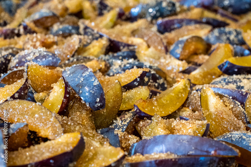 Sweet plum jam with sugar syrup is cooking