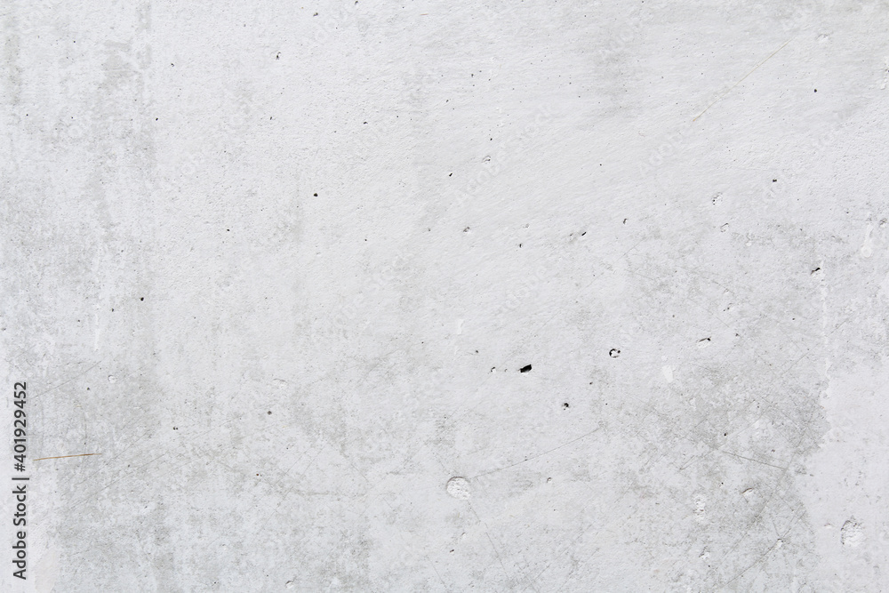 Gray concrete wall peeled of wallpaper. Concrete background. Gray concrete wall peeled of wallpaper. Concrete background.