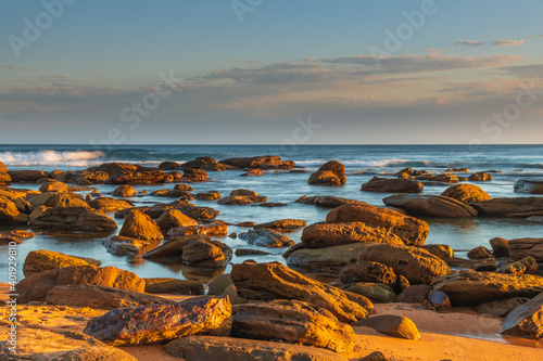 Sunset light, rocks and the sea