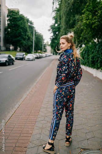Beautiful stylish blonde model in colored suit posing in the street © benevolente