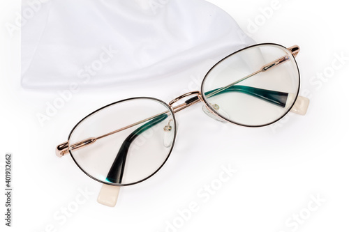 Modern women's eyeglasses against the white wipe for glasses