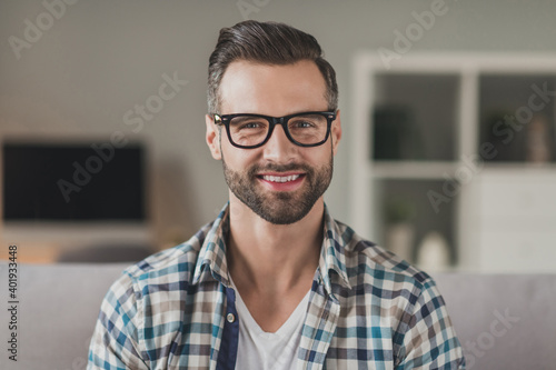 Photo of young handsome cheerful stubble man happy positive smile confident wear casual outfit indoors
