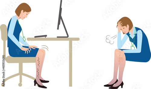仕事中に脚がムズムズするのを我慢して落ち込む女性会社員