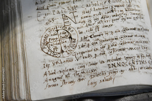 Obraz na płótnie Close-up of an ancient sacred manuscript of 1500s by Benedictine monks - Written