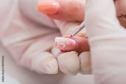 Close-up of hands beautifying - Professional manicurist beautifying a client s hands.