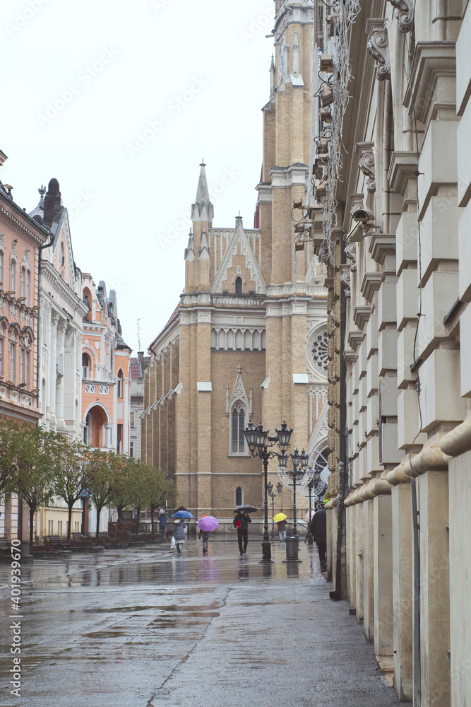 Rain in town - rain drops and reflection in historic center of Novi Sad, Serbia
