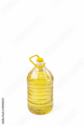 Plastic bottle of cooking oil with handle on white background