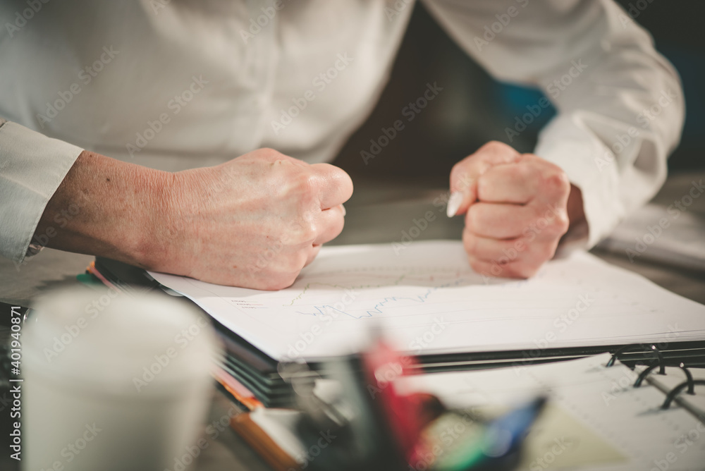 Angry businesswoman at her workplace