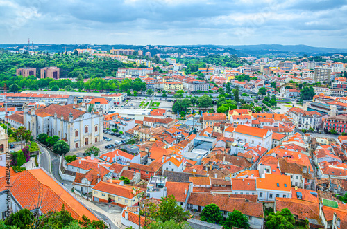 Aerial panoramic view of Leiria city old historical centre with red tiled roofs buildings and Our Lady of the Immaculate Conception Cathedral catholic church, Centro Region, Portugal