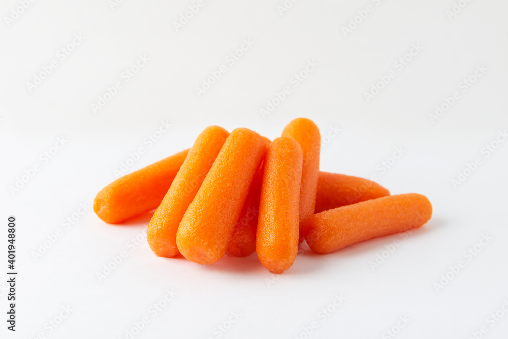 Small peeled pieces of carrot on white background Small peeled pieces of carrot on white background