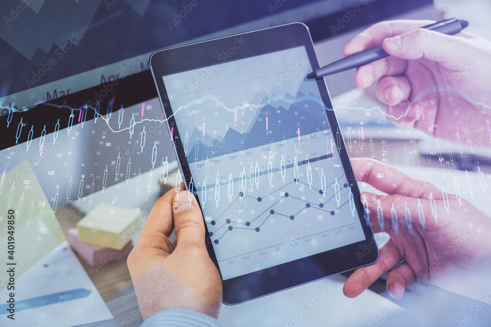 Double exposure of man's hands holding and using a phone and financial chart drawing. Market analysis concept. Double exposure of man's hands holding and using a phone and financial chart drawing. Market analysis concept.