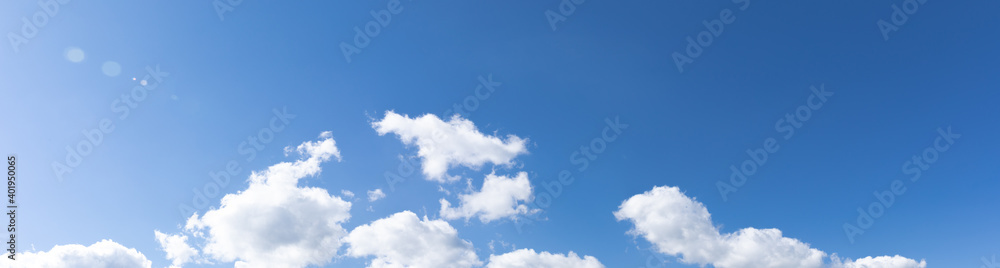 Wide blue sky with clouds panorama, creative copy space, horizontal aspect Wide blue sky with clouds panorama, creative copy space, horizontal aspect