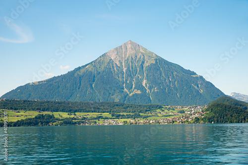 tourist resort Faulensee, at the lakeside of Thunersee, view to Niesen mountain, landscape switzerland