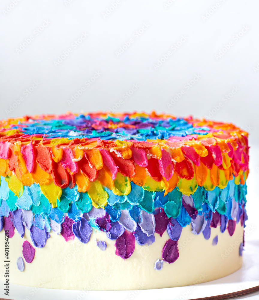Colorful big handmade birthday cake close up.