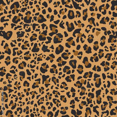 Leopard skin seamless pattern. Abstract pattern of dark spots on an orange background. Fabric print. Vector