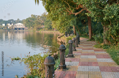 Scenic morning at Rabindra Sarobar Lake (earlier known as the Dhakuria Lake), an artificial waterbody surrounded by lush greenery in large areas, a popular travel spot at South Kolkata, West Bengal. photo