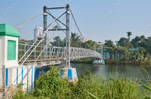 A small hanging cable bridge, approaching Lake mosque, a mosque in middle of Rabindra Sarobar Lake in Kolkata, previously known as Dhakuria lake. This place is favourite to young generation people. photo