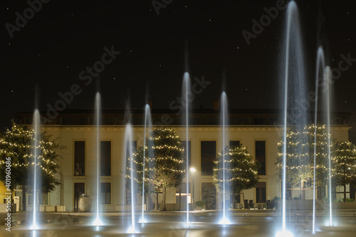 Christmas night, fountains at Ferdinando di Savoia square, starry sky, Peschiera del garda, Italy. © Berg