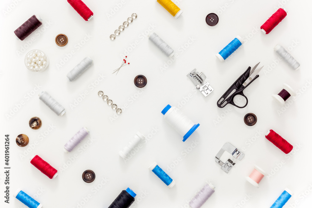Sewing accessories and sewing supplies. Spools of thread, scissors and centimeter Sewing accessories and sewing supplies. Spools of thread, scissors and centimeter