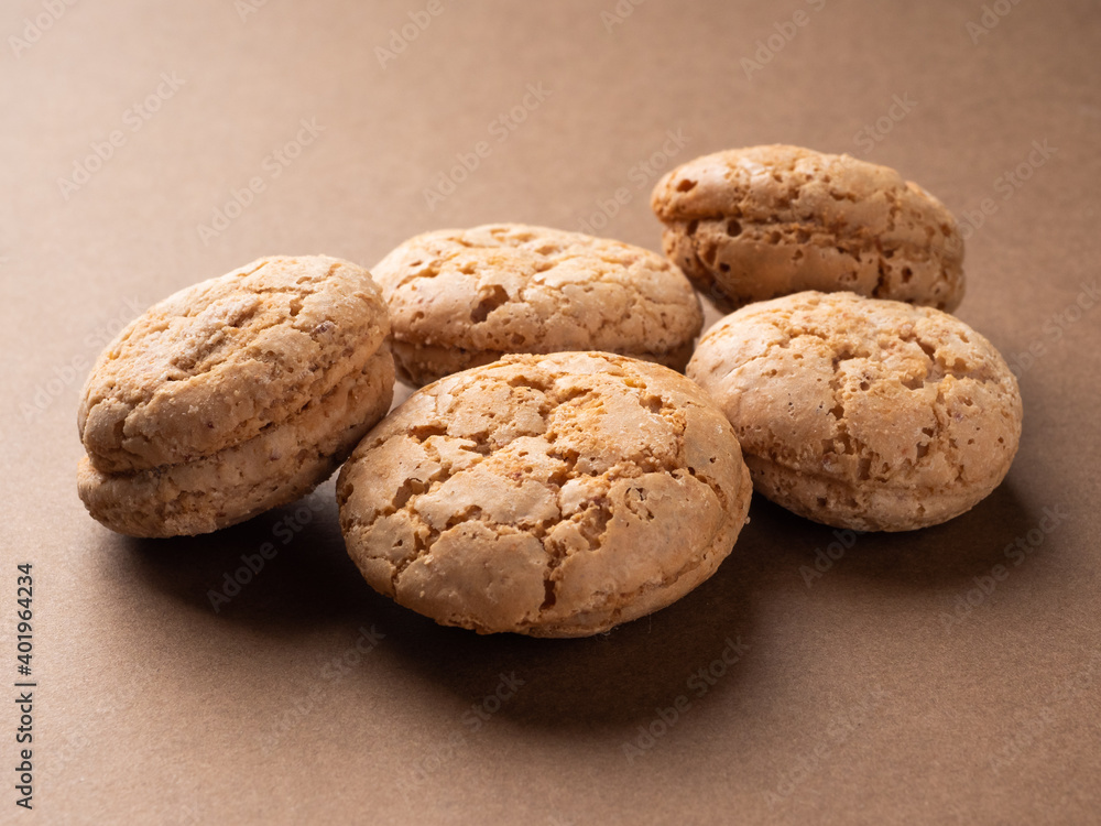 Delicious homemade nut cookies, in warm brown tones, close-up. Cookies in rustic style, background Delicious homemade nut cookies, in warm brown tones, close-up. Cookies in rustic style, background