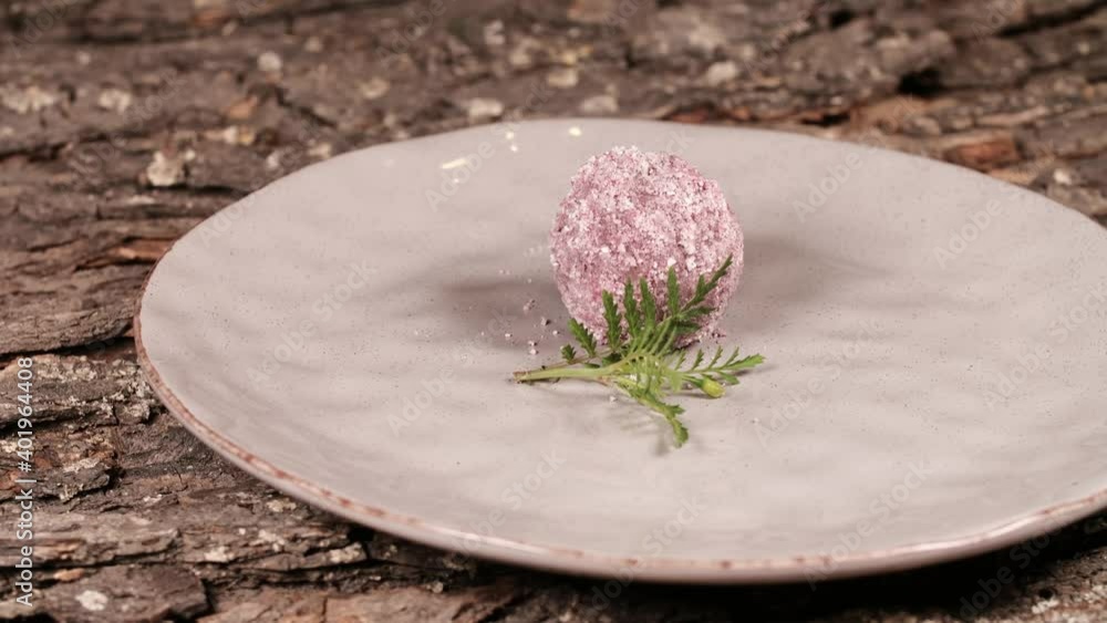 candy sprinkled with coconut flakes on a plate. Rotates on a plate. Cyclic motion candy sprinkled with coconut flakes on a plate. Rotates on a plate. Cyclic motion