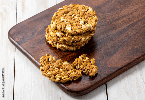 Peanuts brittle or peanuts chikki or gajak made with jaggery and roasted peanuts photo