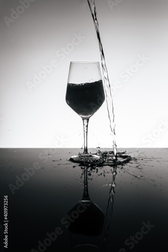 filling wine glass with sparkling water
