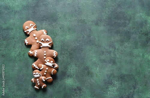 New year concept. Gingerbread family in masks on a green concrete background. View from above. photo