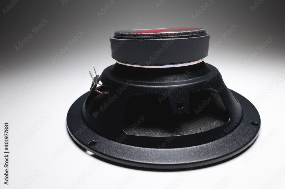New car speakers on a white background in contrasting light. Wide angle audio background New car speakers on a white background in contrasting light. Wide angle audio background