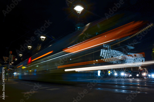 Moving tram in the city center of Graz, Styria region, Austria, by night