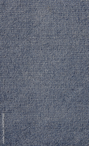 Denim texture in close up view with copy space for vintage background or wallpaper. Blue jeans pattern no seam with macro style to preset about classic fashion cloths concept. Indigo color fabric.