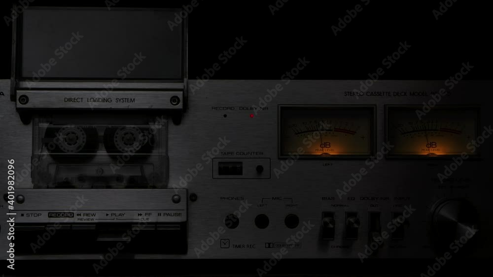 Vintage cassette player deck from 80s. Stereo recorder with rotating