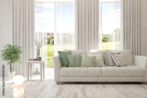 White living room with sofa and summer landscape in window. Scandinavian interior design. 3D illustration