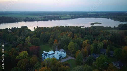 Aerial View of the Old Palace in Stameriena, Latvia. Colorful Autumn Landscape Time at Sunset. Stameriena Castle in Eastern Latvia After the Facade Reconstruction. 4k Video photo