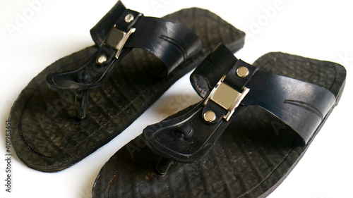Sandals are made from recycled tires on white background.