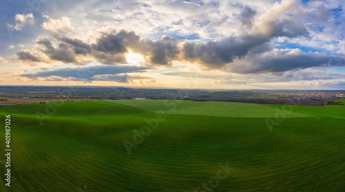 Flying over an green empty field