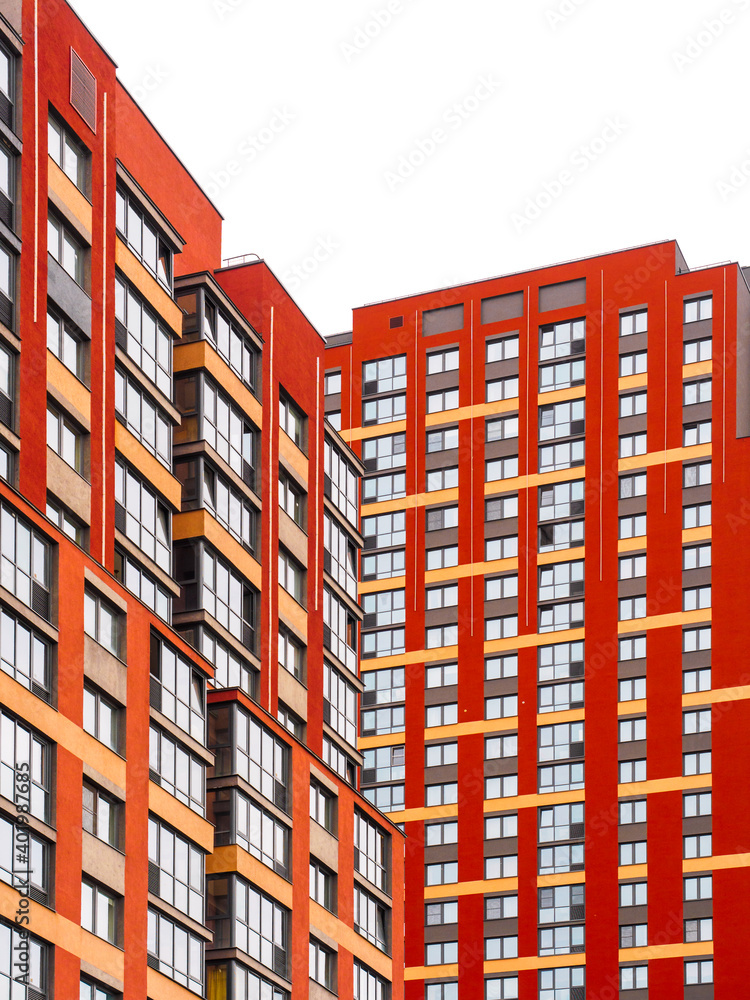 Modern architecture. Red skyscrapers facade. Multi-storey residential buildings. Close-up geometric background. Isolate