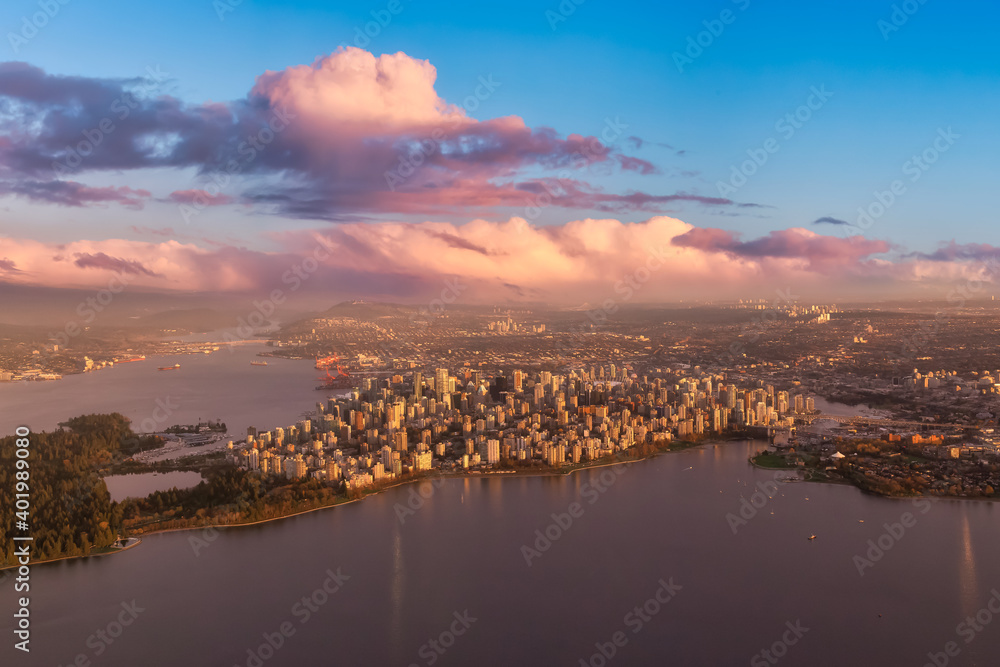 Aerial view of Stanley Park and Downtown Vancouver, BC, Canada. Dramatic Colorful Sunset Sky Art Render.