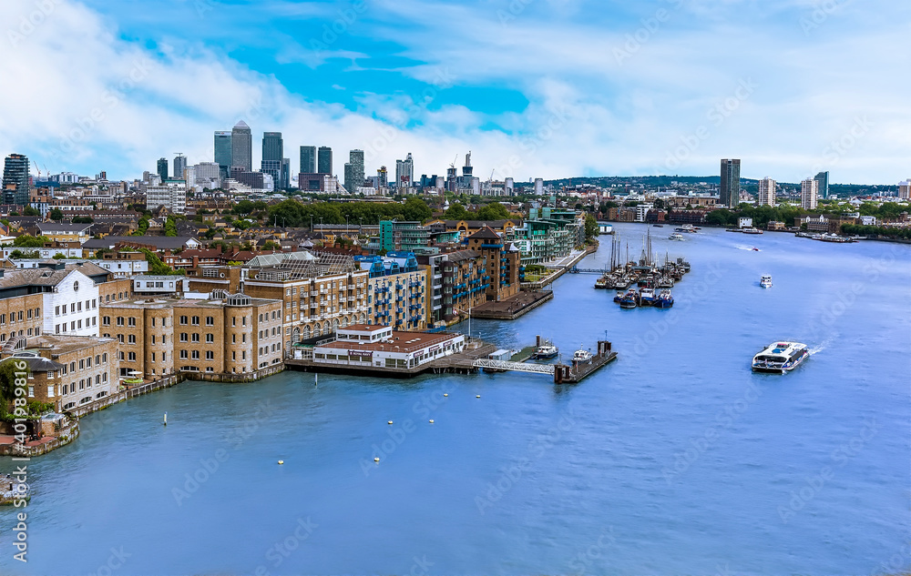 A view eastward down the River Thames from Tower Bridge, London, UK towards Canary Wharf  in the distance.