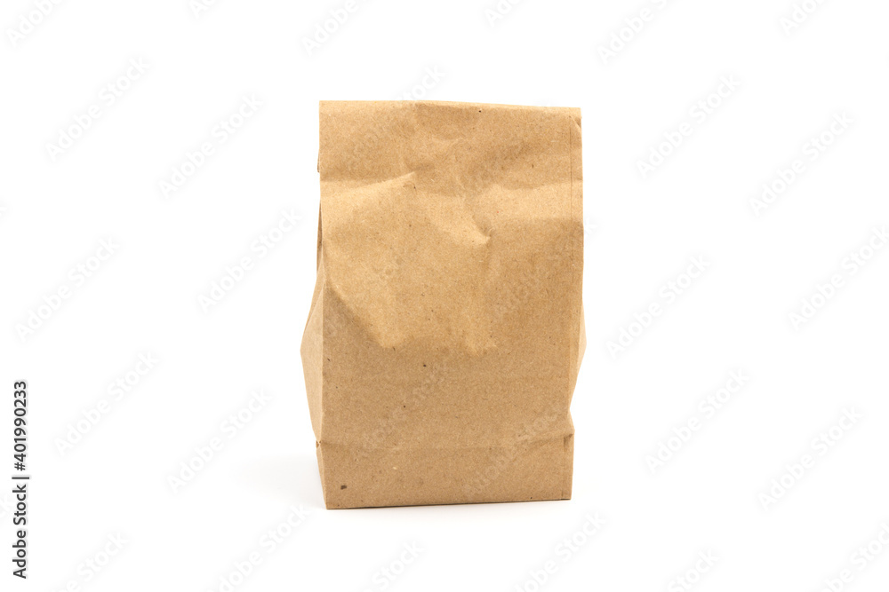 paper disposable bag of brown kraft paper on white background, concept of rejection of plastic packaging, template for designer, packaging for contactless product delivery paper disposable bag of brown kraft paper on white background, concept of rejection of plastic packaging, template for designer, packaging for contactless product delivery